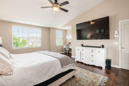 1883 Caplinger Dr, Grove City, OH 43123 - bedroom featuring vaulted ceiling, wood finished floors, and a ceiling fan