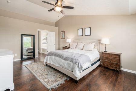 1883 Caplinger Dr, Grove City, OH 43123 - bedroom featuring wood finished floors, vaulted ceiling, and a ceiling fan