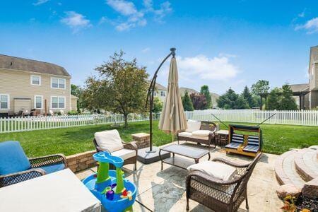 1883 Caplinger Dr, Grove City, OH 43123 - fenced backyard featuring outdoor lounge area and a patio