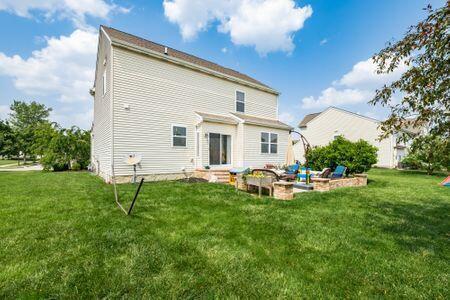 1883 Caplinger Dr, Grove City, OH 43123 - back of property featuring a yard
