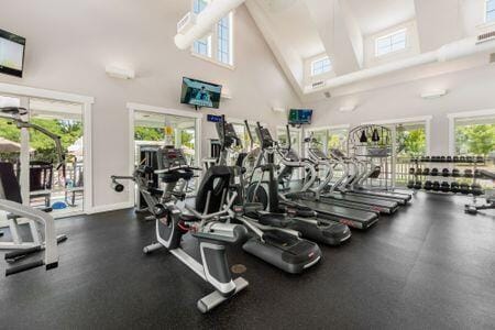 1883 Caplinger Dr, Grove City, OH 43123 - gym with high vaulted ceiling and healthy amount of natural light