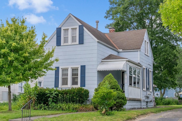1561 Glenn Ave, Columbus, OH 43212 - view of front of house featuring a chimney and a shingled roof
