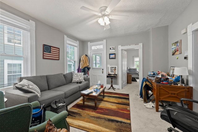 1561 Glenn Ave, Columbus, OH 43212 - carpeted living area with a textured ceiling, a ceiling fan, and an office area