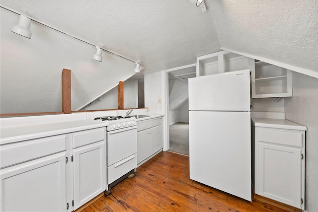 1561 Glenn Ave, Columbus, OH 43212 - kitchen with white appliances, a textured ceiling, track lighting, vaulted ceiling, and dark wood-style flooring