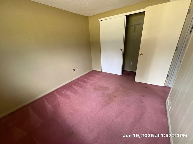 2652 Landsburn Dr, Columbus, OH 43231 - unfurnished bedroom with carpet, a closet, and a textured ceiling