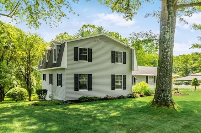 277 Mill Race Rd, Granville, OH 43023 - view of front of home featuring a front lawn, a gambrel roof, and a shingled roof
