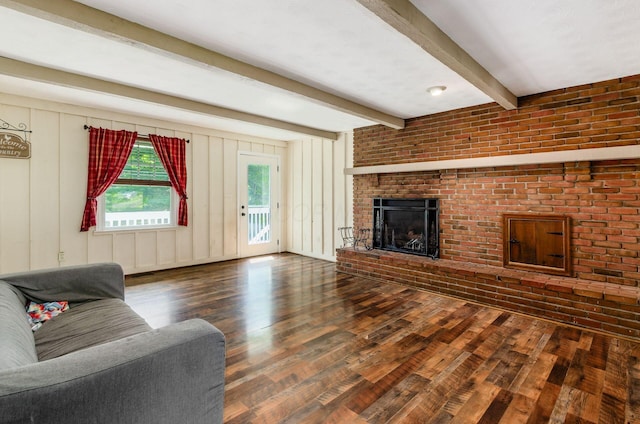 277 Mill Race Rd, Granville, OH 43023 - living room with wood finished floors, beamed ceiling, and a brick fireplace