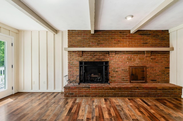 277 Mill Race Rd, Granville, OH 43023 - unfurnished living room with beam ceiling, wood finished floors, and a fireplace