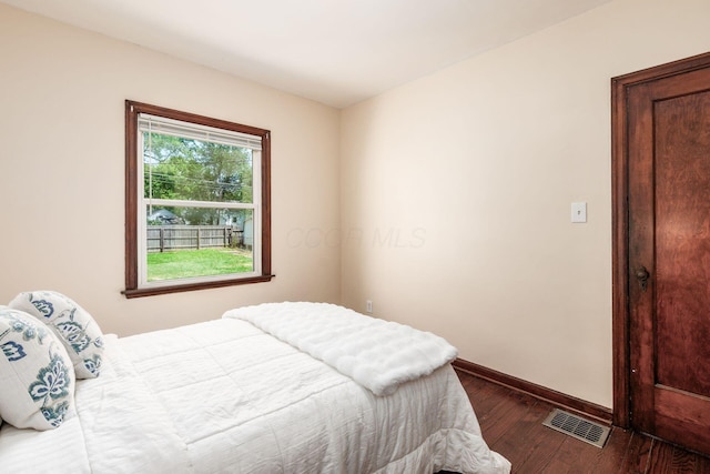 854 E Weber Rd, Columbus, OH 43211 - bedroom with dark wood-style floors and baseboards