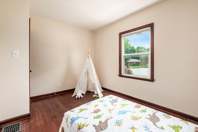 854 E Weber Rd, Columbus, OH 43211 - bedroom with wood finished floors and baseboards