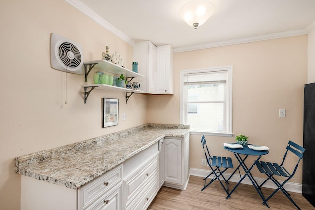 854 E Weber Rd, Columbus, OH 43211 - kitchen with light wood finished floors, ornamental molding, white cabinets, open shelves, and light stone countertops
