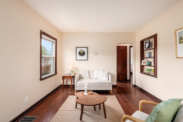 854 E Weber Rd, Columbus, OH 43211 - living room with dark wood finished floors and baseboards