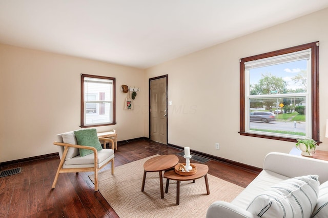 854 E Weber Rd, Columbus, OH 43211 - living room with dark wood-style flooring and baseboards