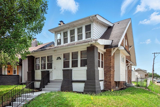 87 N Warren Ave, Columbus, OH 43204 - view of front facade with a chimney, entry steps, and roof with shingles