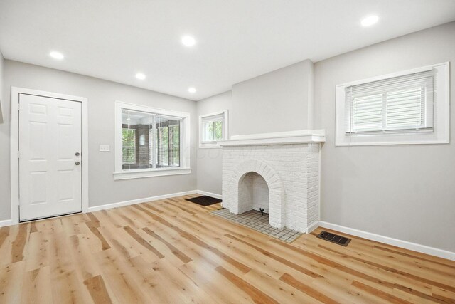 87 N Warren Ave, Columbus, OH 43204 - unfurnished living room with wood finished floors and recessed lighting
