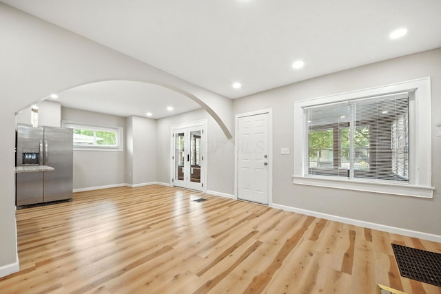 87 N Warren Ave, Columbus, OH 43204 - entrance foyer with arched walkways, wood finished floors, recessed lighting, and french doors