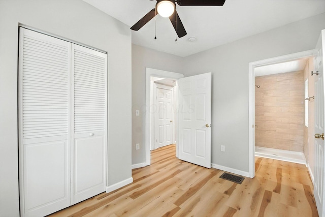 87 N Warren Ave, Columbus, OH 43204 - unfurnished bedroom with light wood-style flooring, a closet, and a ceiling fan