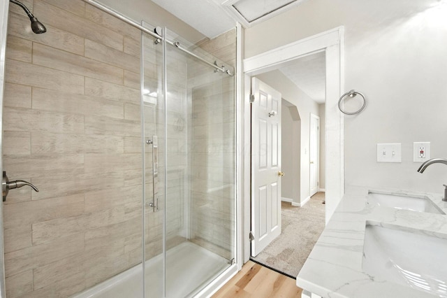 87 N Warren Ave, Columbus, OH 43204 - bathroom featuring a shower stall and wood finished floors