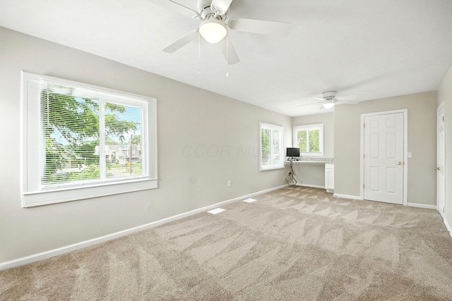 87 N Warren Ave, Columbus, OH 43204 - spare room with ceiling fan, light carpet, and a desk
