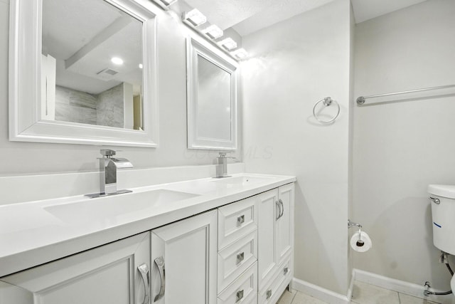 87 N Warren Ave, Columbus, OH 43204 - bathroom with double vanity and tile patterned floors