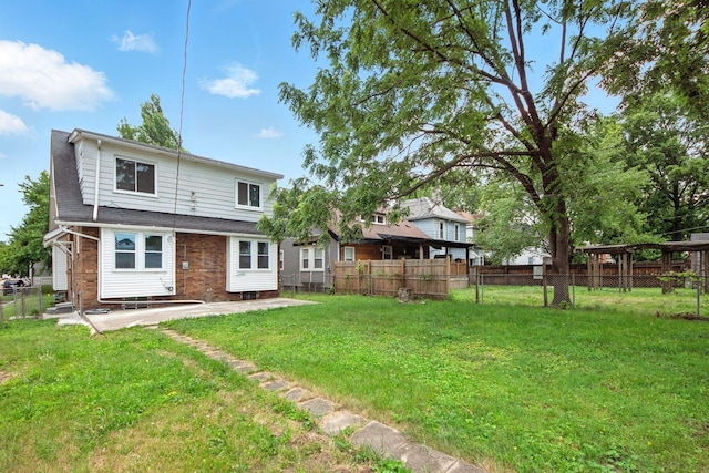 87 N Warren Ave, Columbus, OH 43204 - rear view of property with a patio and brick siding
