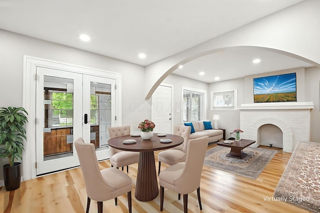 87 N Warren Ave, Columbus, OH 43204 - dining room with arched walkways, light wood-style flooring, healthy amount of natural light, and recessed lighting