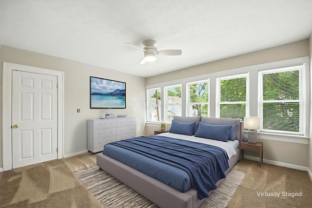 87 N Warren Ave, Columbus, OH 43204 - carpeted bedroom featuring baseboards and ceiling fan