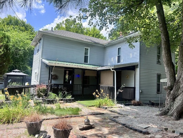 27380 Miller Rd, Rockbridge, OH 43149 - rear view of property featuring a gazebo, covered porch, and a chimney