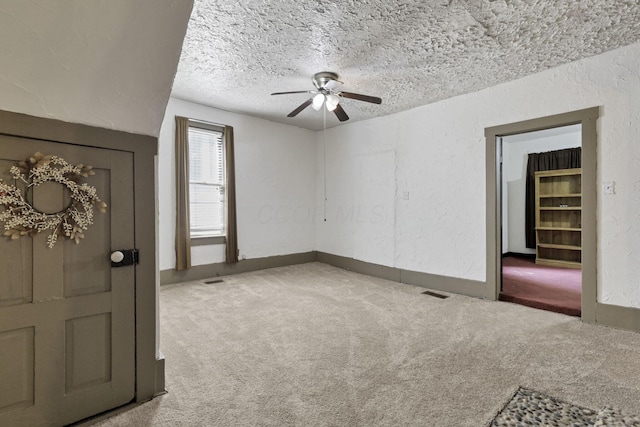 27380 Miller Rd, Rockbridge, OH 43149 - unfurnished room with a ceiling fan, carpet flooring, a textured ceiling, and a textured wall