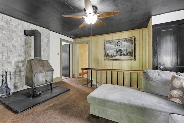 27380 Miller Rd, Rockbridge, OH 43149 - bedroom featuring a wood stove, carpet flooring, and wood walls