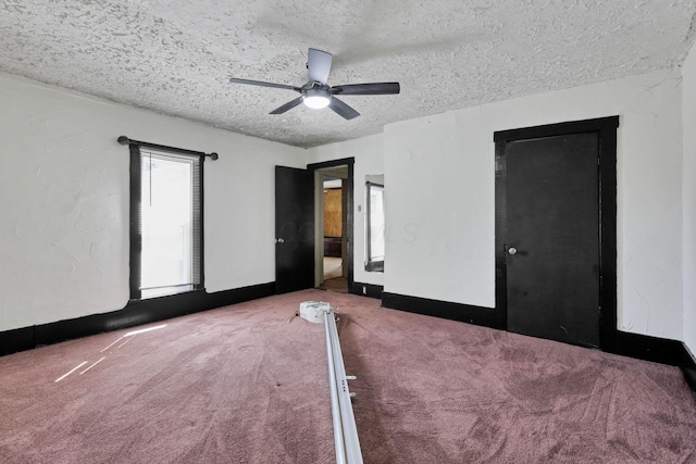 27380 Miller Rd, Rockbridge, OH 43149 - unfurnished bedroom featuring carpet, a textured ceiling, and ceiling fan