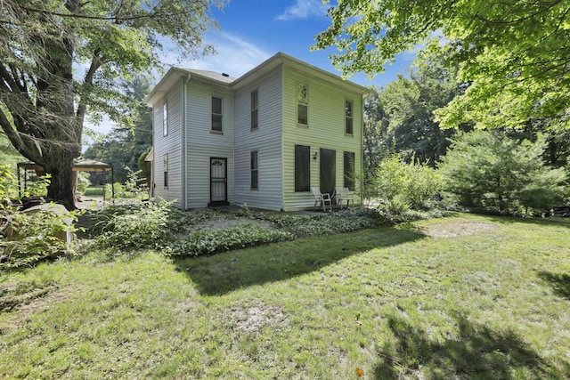27380 Miller Rd, Rockbridge, OH 43149 - back of house featuring a yard