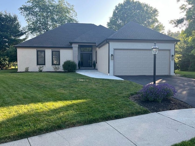 450 Village Ridge Ct, Powell, OH 43065 - view of front facade with asphalt driveway, a garage, a front yard, stucco siding, and roof with shingles