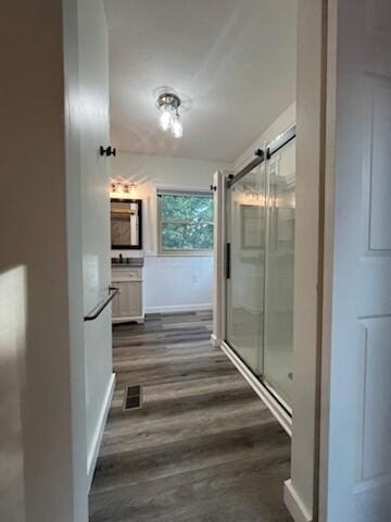 450 Village Ridge Ct, Powell, OH 43065 - full bathroom with vanity, a stall shower, and wood finished floors