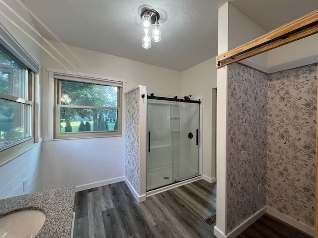 450 Village Ridge Ct, Powell, OH 43065 - full bathroom featuring wood finished floors, a shower stall, and vanity