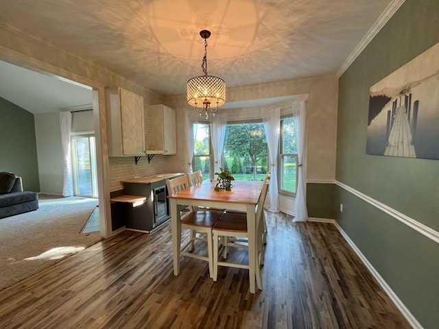 450 Village Ridge Ct, Powell, OH 43065 - dining room with plenty of natural light, dark wood-style floors, a chandelier, and crown molding