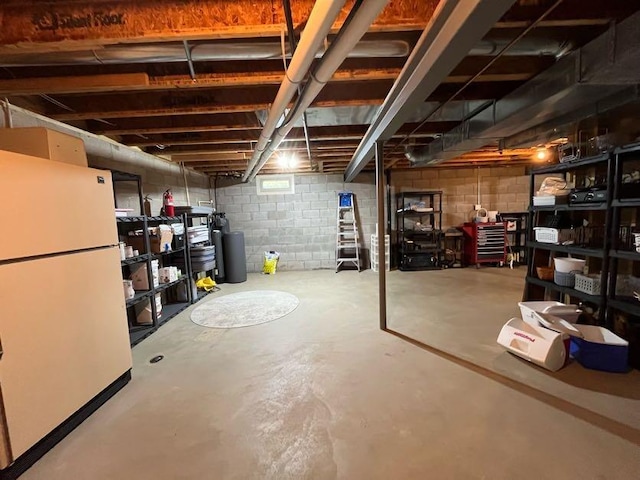450 Village Ridge Ct, Powell, OH 43065 - basement featuring freestanding refrigerator, a water softener, and concrete block wall