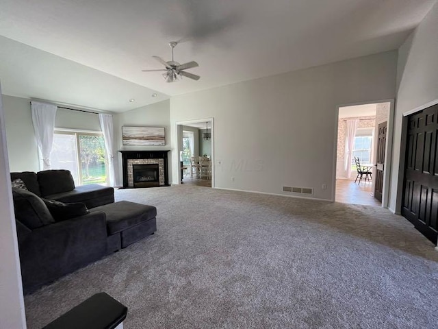 450 Village Ridge Ct, Powell, OH 43065 - carpeted living room with plenty of natural light, lofted ceiling, ceiling fan, and a fireplace