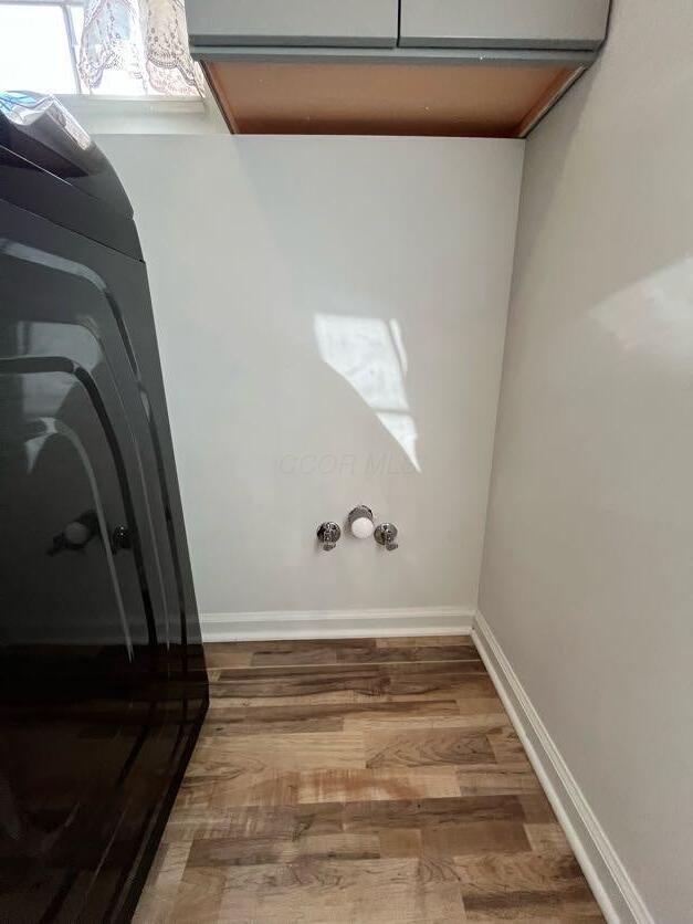 450 Village Ridge Ct, Powell, OH 43065 - washroom with wood finished floors and baseboards
