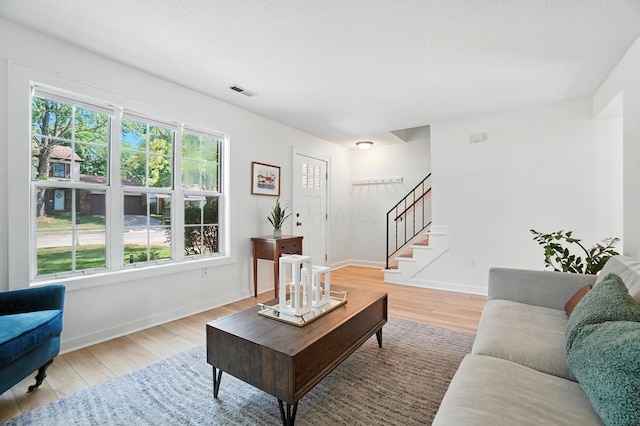 1817 Ibson Dr, Powell, OH 43065 - living area featuring stairway and light wood-style floors