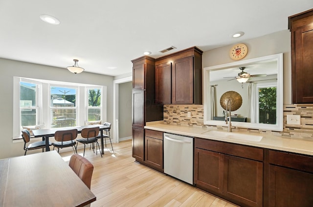 1817 Ibson Dr, Powell, OH 43065 - kitchen with stainless steel dishwasher, light countertops, decorative backsplash, healthy amount of natural light, and recessed lighting