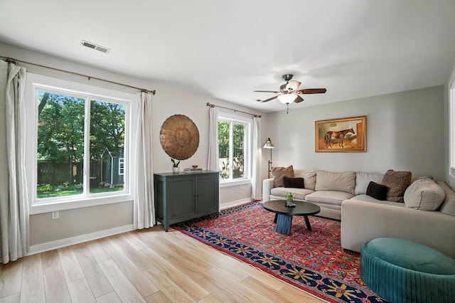 1817 Ibson Dr, Powell, OH 43065 - living area with ceiling fan and light wood-style floors