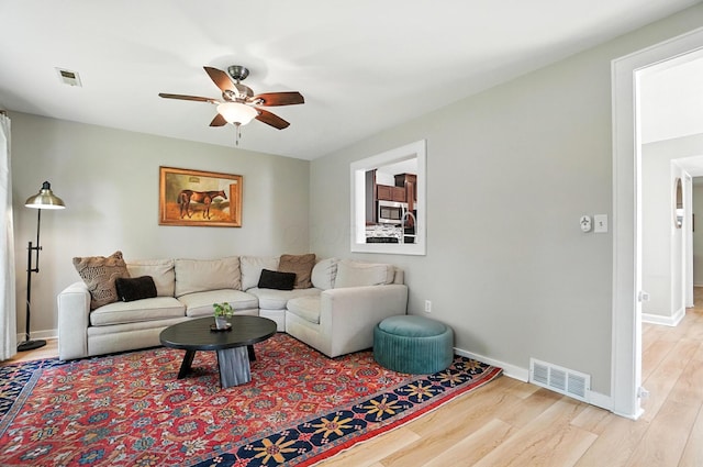 1817 Ibson Dr, Powell, OH 43065 - living room featuring ceiling fan and light wood-style floors