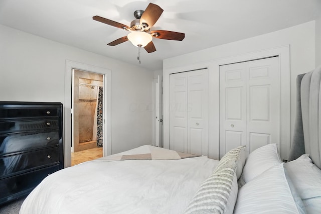 1817 Ibson Dr, Powell, OH 43065 - bedroom featuring multiple closets, a ceiling fan, and ensuite bath