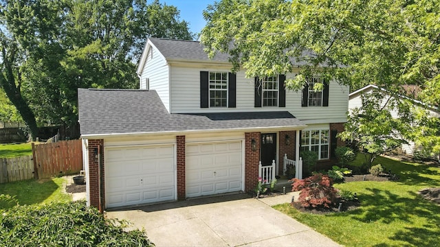 1817 Ibson Dr, Powell, OH 43065 - traditional-style house featuring brick siding, concrete driveway, roof with shingles, and a garage