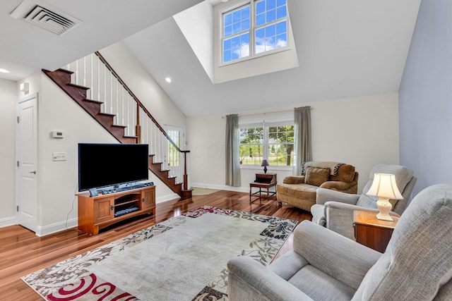 145 Glen Mawr Cir, Delaware, OH 43015 - living room featuring high vaulted ceiling, stairway, wood finished floors, and recessed lighting