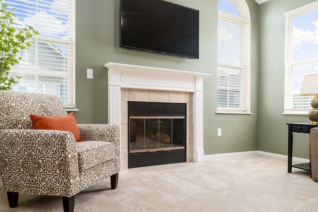 4124 Aumbrey Ct, New Albany, OH 43054 - carpeted living room featuring a tile fireplace and baseboards
