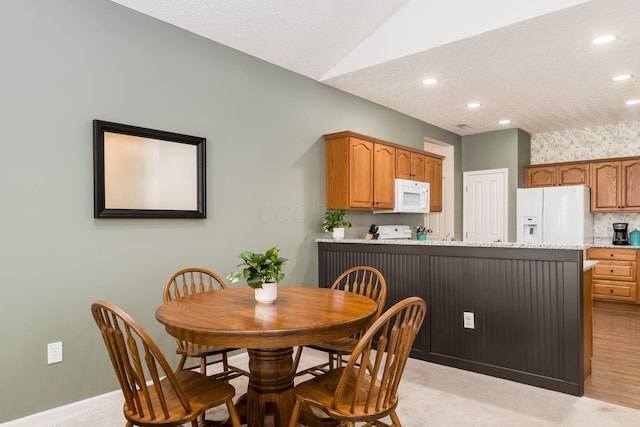 4124 Aumbrey Ct, New Albany, OH 43054 - dining room featuring recessed lighting, vaulted ceiling, and light colored carpet