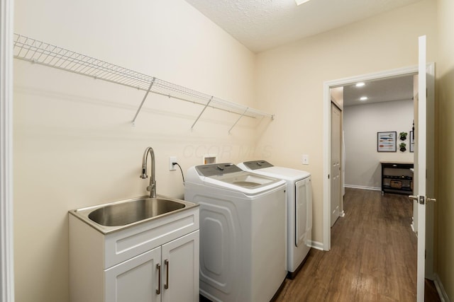 4124 Aumbrey Ct, New Albany, OH 43054 - laundry room with washing machine and dryer, dark wood-type flooring, and cabinet space