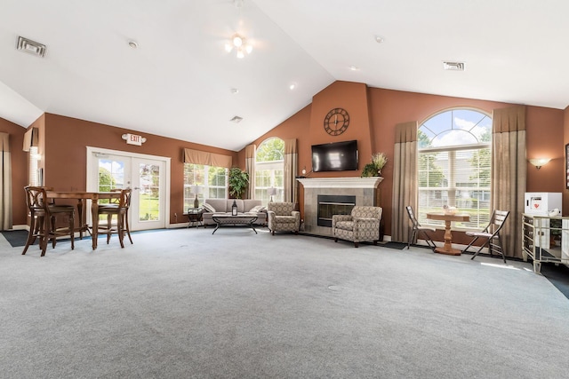 4124 Aumbrey Ct, New Albany, OH 43054 - living room featuring carpet floors, french doors, a tile fireplace, healthy amount of natural light, and high vaulted ceiling